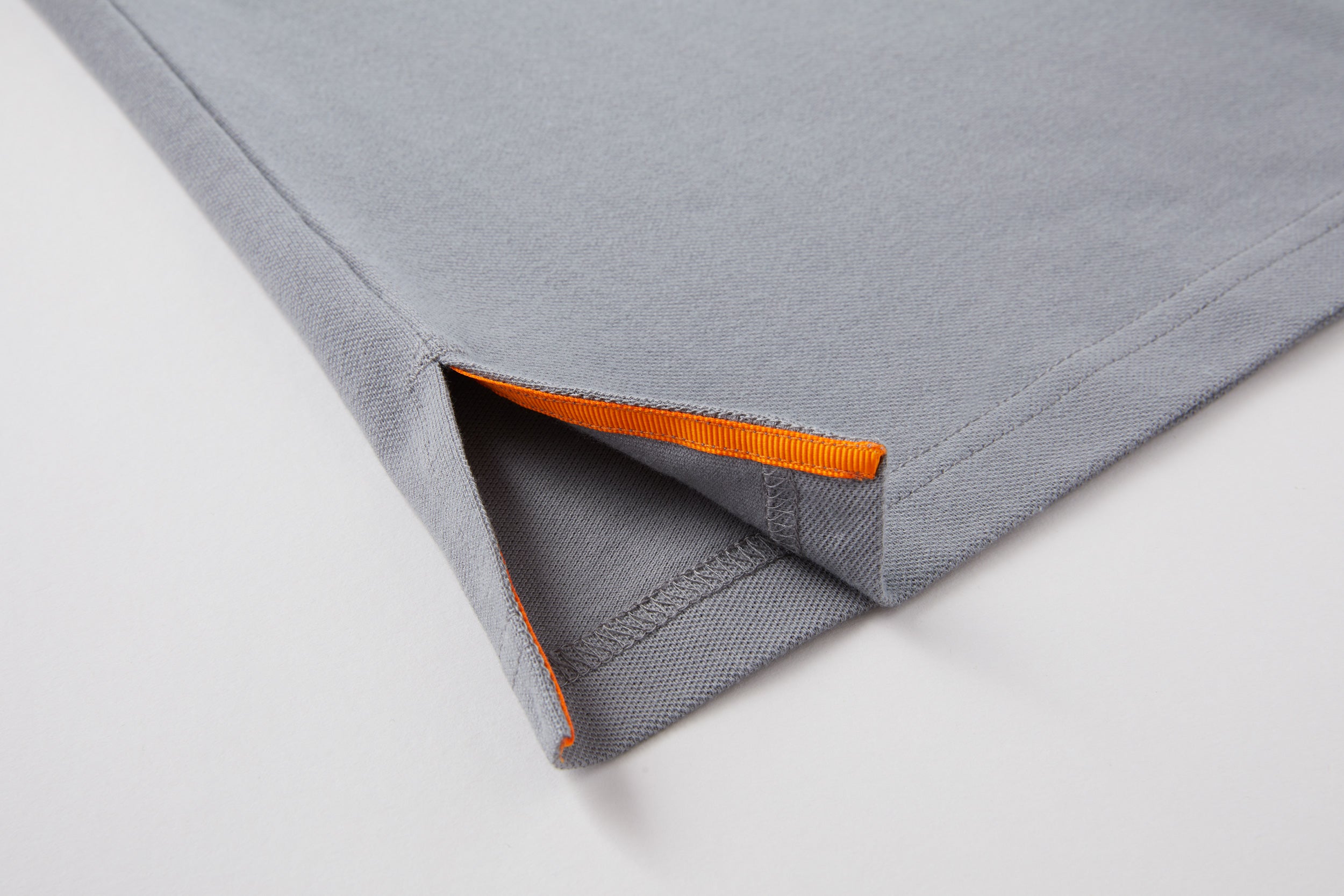 grey polo shirt detail
