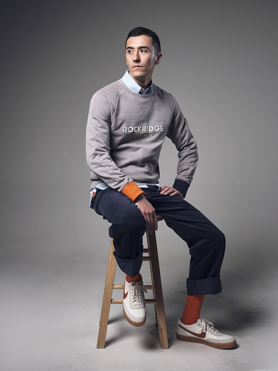 Alex_sweatshirt_sitting_on_stool