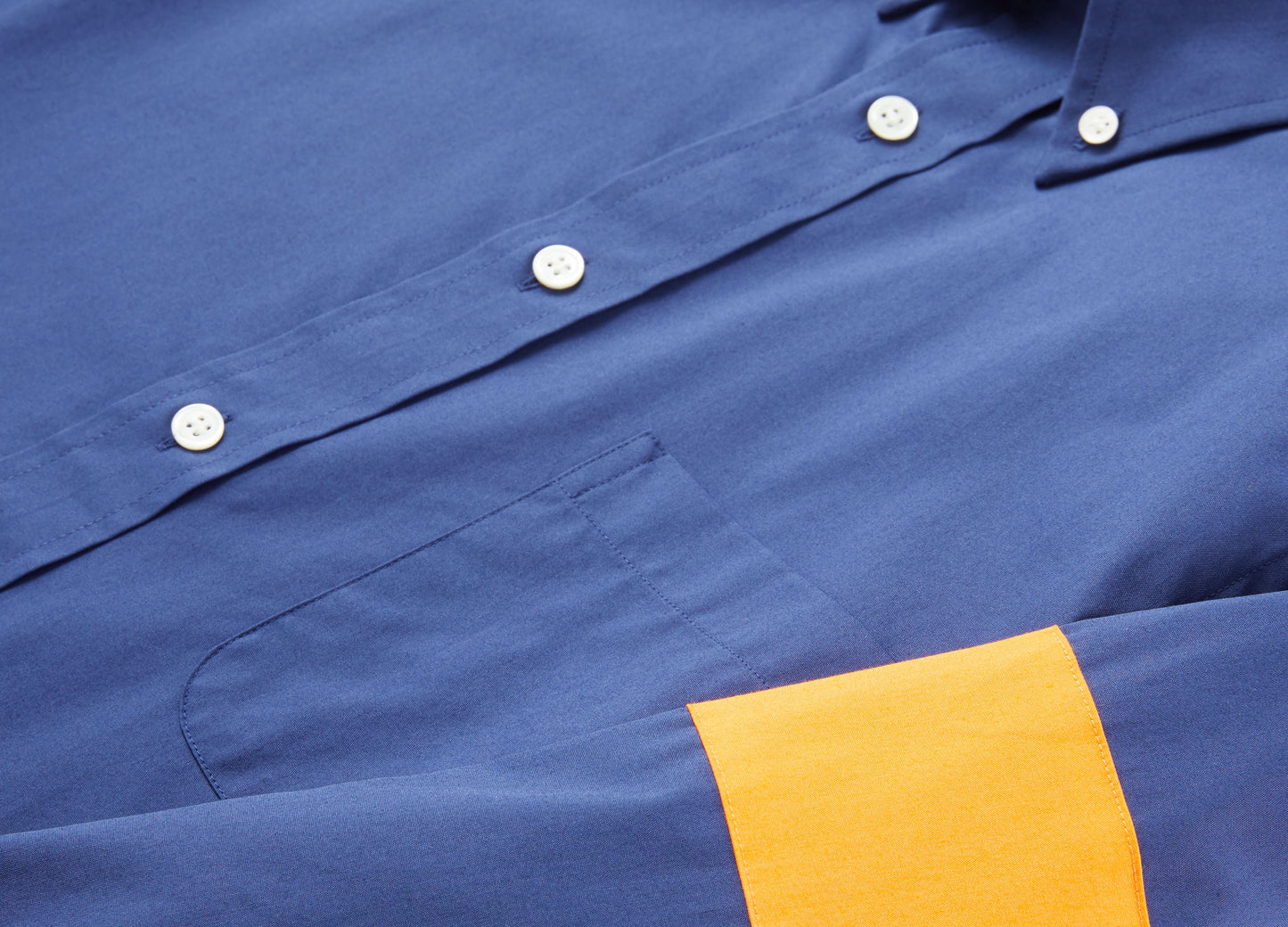 Our signature fall button down is made from cotton and remains neat beneath a sweater.