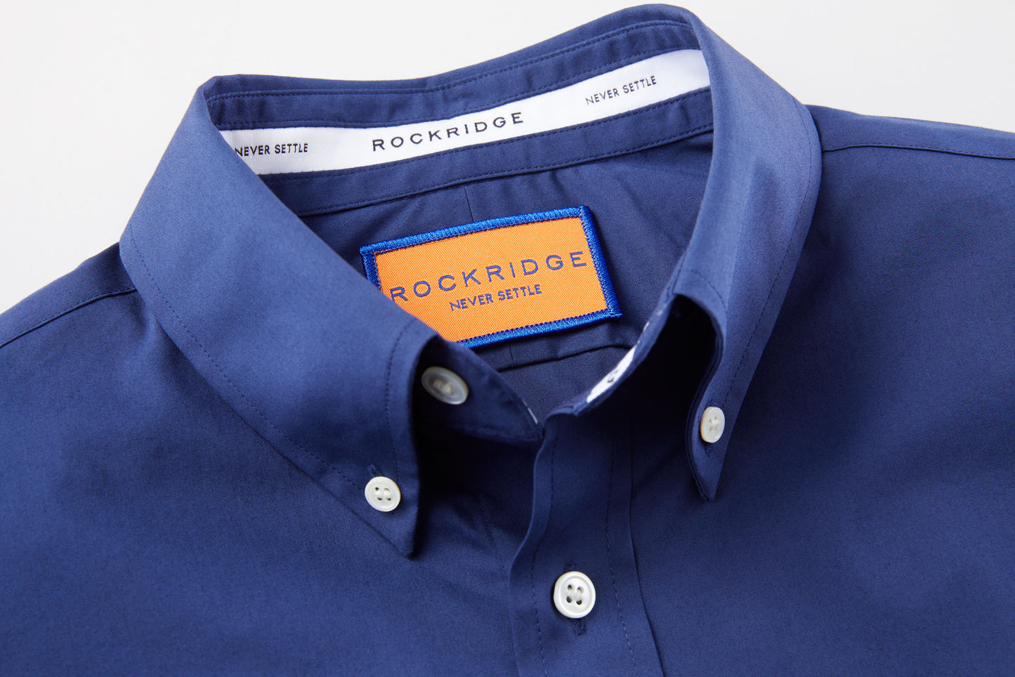 Our signature fall button down is made from cotton and remains neat beneath a sweater.